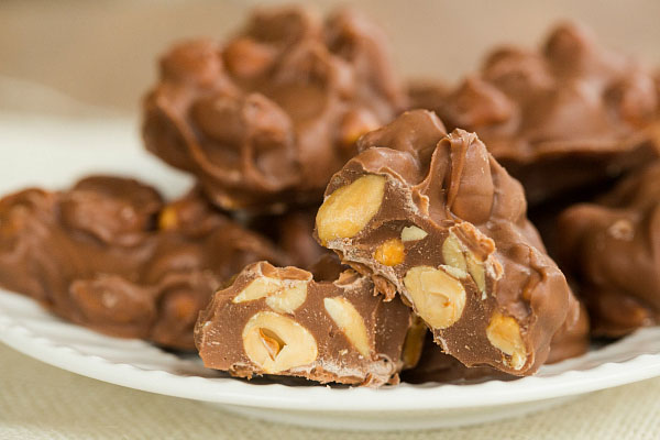 SLOW COOKER CHOCOLATE-COVERED PEANUT CLUSTERS