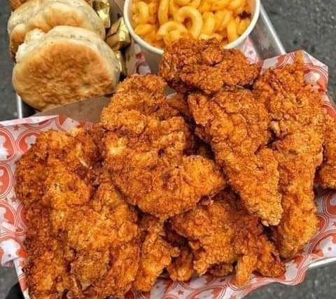 Some beautiful chicken tenders with pasta, cheese and some biscuits